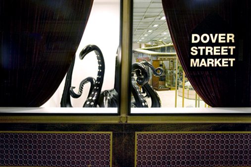 Exterior view of Prop Studios' octopus sculpture through the window of Les Trois Garcons