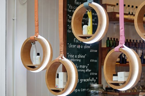 LED light rings displaying products in the window display of Facegym's flagship store