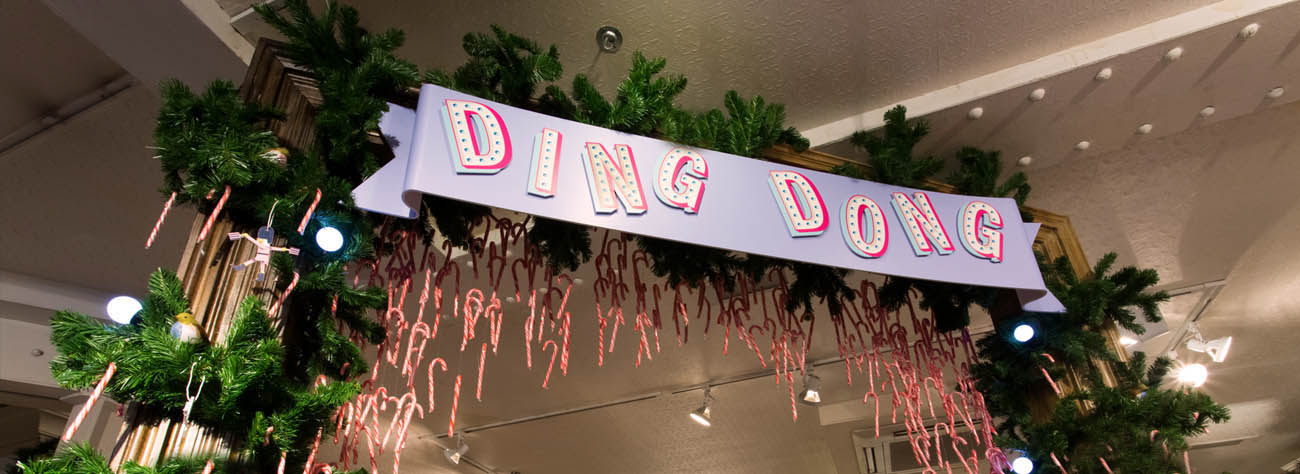 Candy-cane decorated banner, part of Prop Studios' traditional yet youthful Christmas instore design scheme for Jack Wills